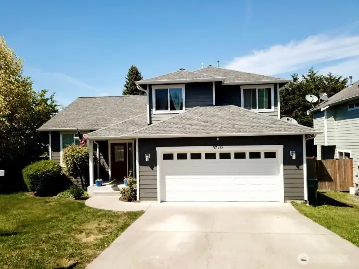 Front of the house w/ ring doorbell cam and second cam above garage door. Front of the house w/ ring doorbell cam and second cam above garage door.