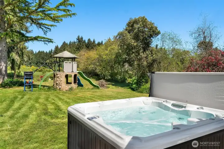 Hot tub and play area off lower level