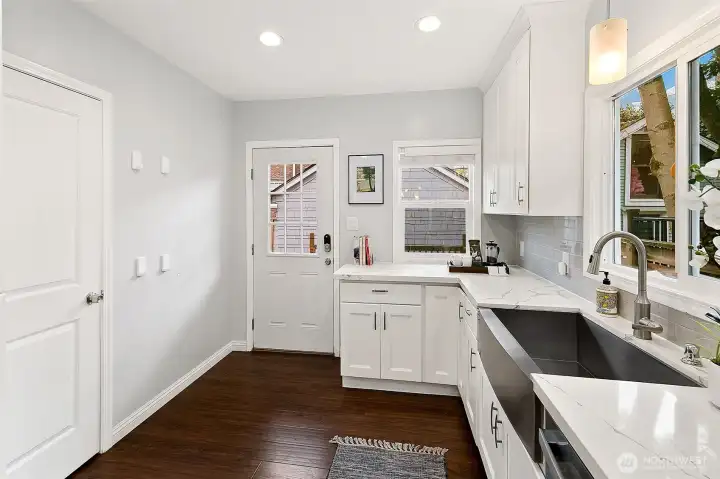 Kitchen with direct access to the back deck, garage and yard. So convenient!