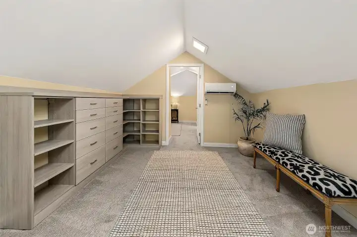 Lined with shelving, drawers and storage in the eaves ~ choose to create the most spectacular closet or a media room for game or movie nights.