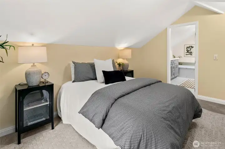 The primary bedroom has vaulted ceilings, a wall of closets and attached full bathroom.