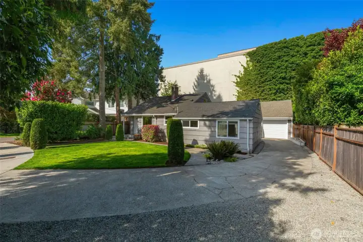 Front of house with Driveway to detached garage.