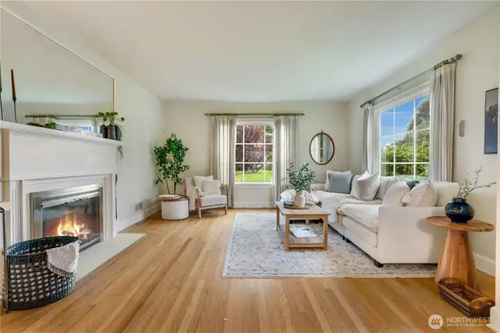 Original Oak hardwood floors line the large living when you enter. The room is well lit with large double pane windows.