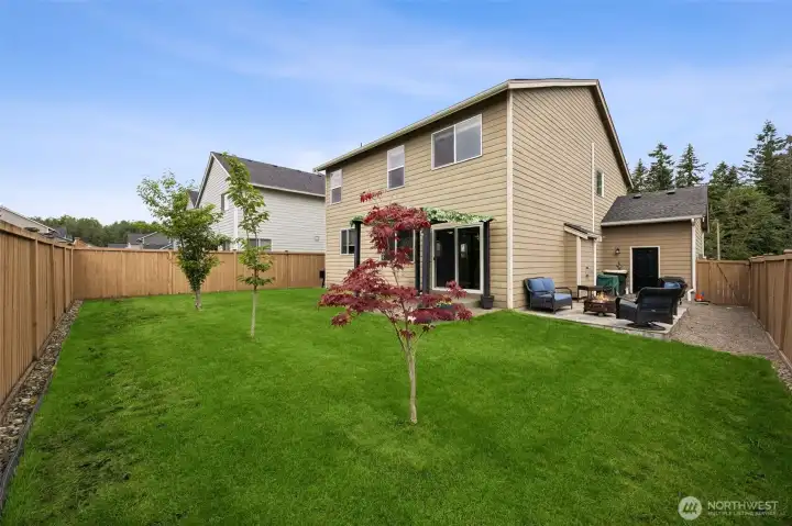 Large backyard with trees