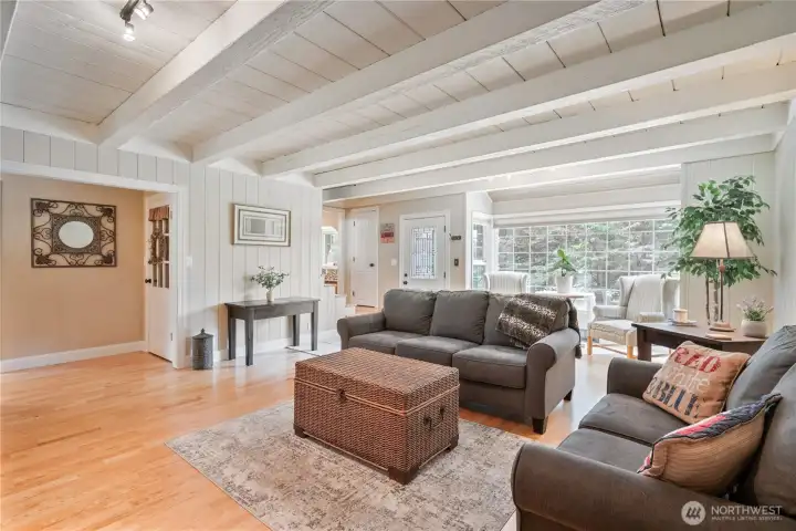 Beautiful living room with gas fireplace, engineered hardwood floors, custom built ins, natural light Beautiful living room with gas fireplace, engineered hardwood floors, custom built ins, natural light