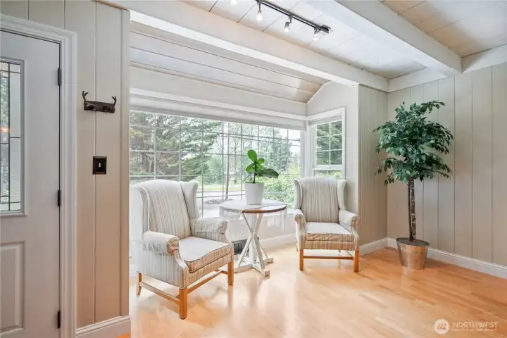 Beautiful living room with gas fireplace, engineered hardwood floors, custom built ins, natural light Beautiful living room with gas fireplace, engineered hardwood floors, custom built ins, natural light