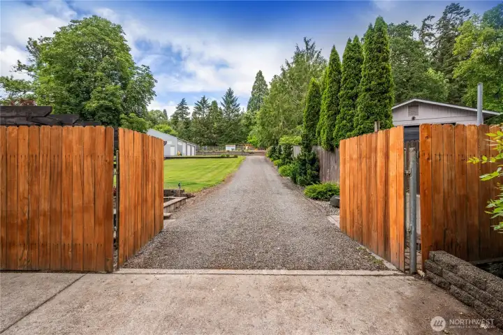 Front circular driveway leads to backyard and shop Front circular driveway leads to backyard and shop