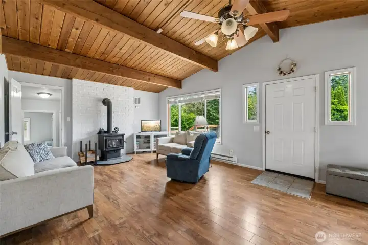 Living room with cozy wood burning stove. Living room with cozy wood burning stove.