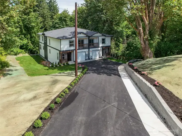 Premium landscaping including sod and hydro seed.