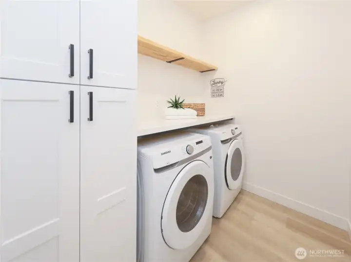 Dream laundry with plenty of storage and countertop!