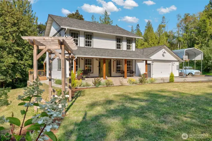Mature landscaping, 2 car garage and RV carport.