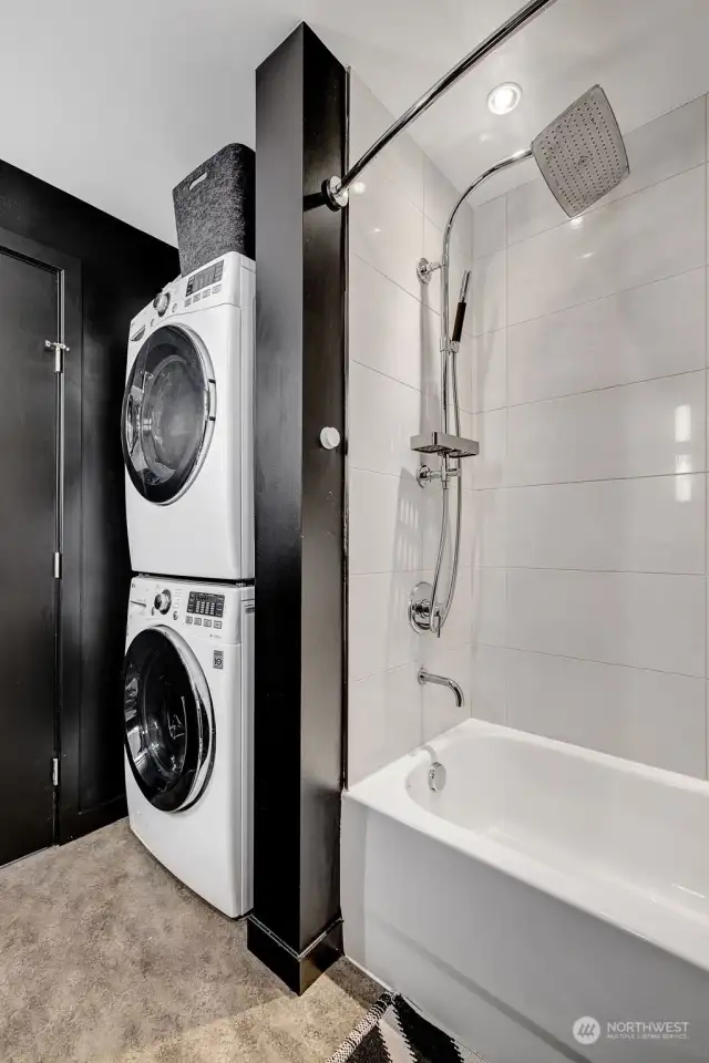 Full size laundry located in bathroom.