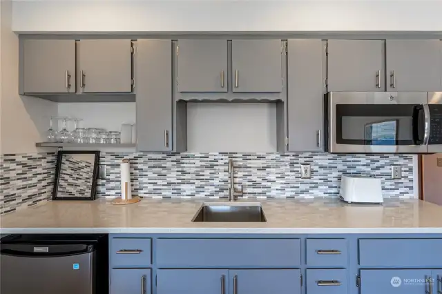 Updated kitchen cabinets, backsplash and appliances