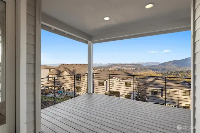 Upper level primary bedroom covered deck.