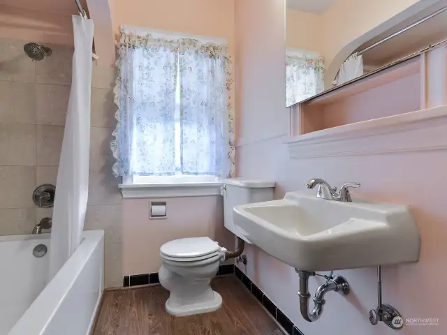 The renovated full bathroom with Botticino Florito polished marble.