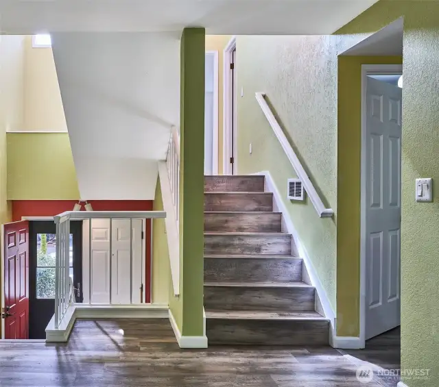 Closer view of stair case that emphasizes the natural light.