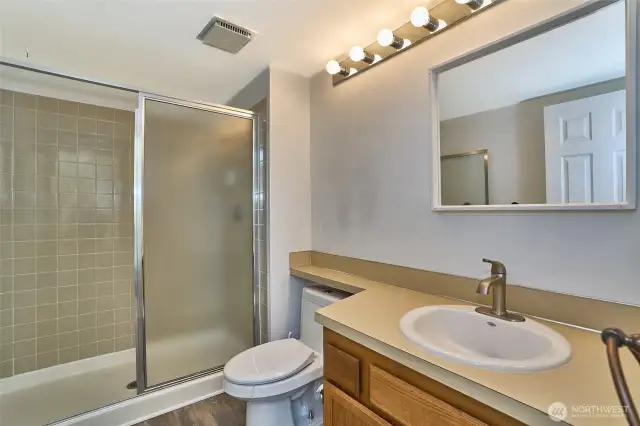 Comfortable 3/4 bath is located on 2nd upper level next to the first bedroom.