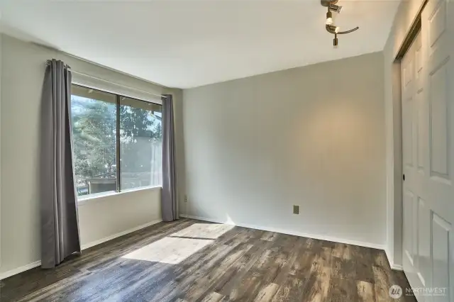 Large window is a nice accent in the first bedroom.