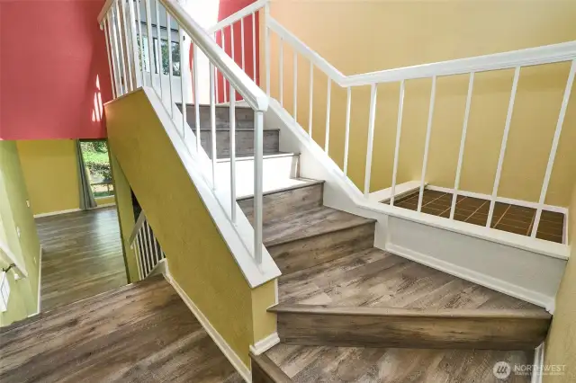 Multi-level stairs that lead you to a private primary bedroom.