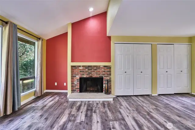 Another view displays the cozy wood burning fireplace.