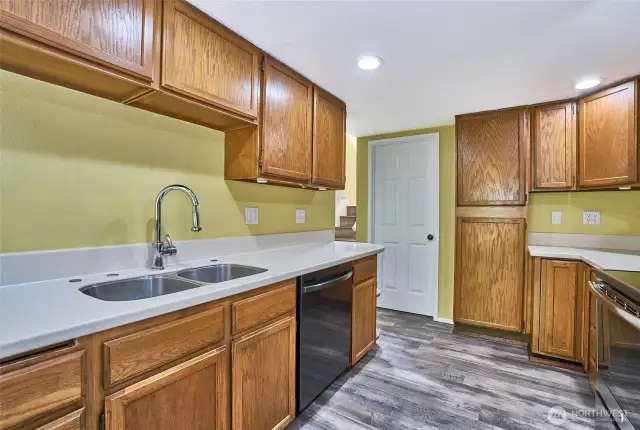 Kitchen shows plenty of cabinet space.