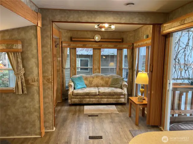 This room has a privacy curtain with a hide-a-bed for your guests.