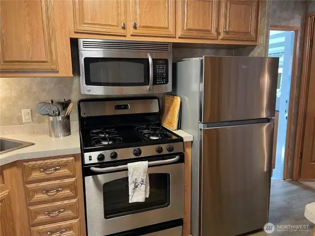 Full-size, stainless-steel appliances.