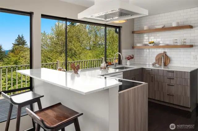 The thoughtfully remodeled kitchen has plenty of space to whip up a meal for many or a quick bite to eat for a few. What is your dining pleasure?
