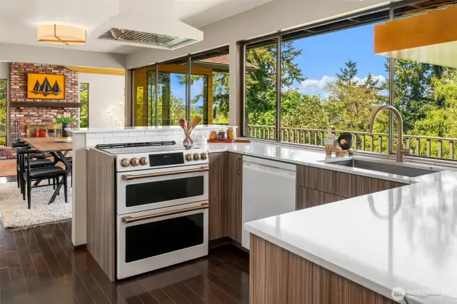 Notice the gentle transition of kitchen to dining room to living room. Every room has a view!