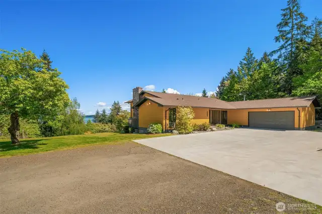 A new concrete parking pad greets you as you drive up to 23322 63rd Avenue SW, or park in the attached 2-car garage. Plenty of room for a half-court hoop game or pickleball! Check out the new roof.