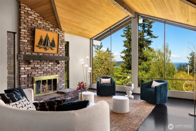 The spacious upper living room has a new cedar ceiling and new flooring. Relax in the evening with the fire burning as you watch the world settle in for the night.