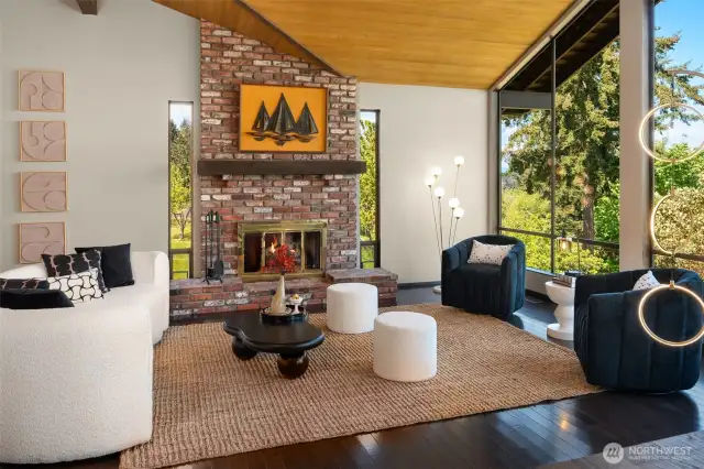 The cedar cathedral ceiling and floor to ceiling windows make the upper living room a visual delight!