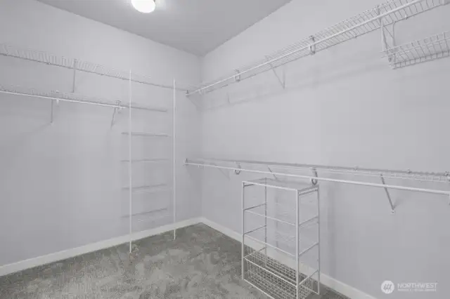 Spacious walk-in closet has room for all your things.