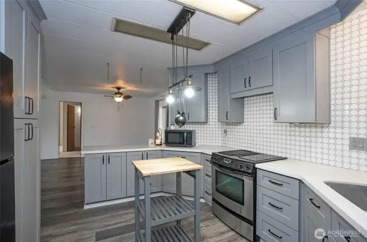 From the kitchen, take in the dining area’s open layout.