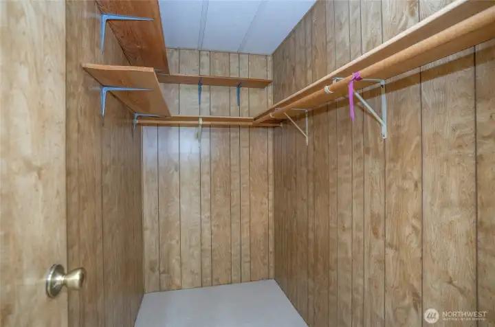 Walk-in closet in the primary suite.