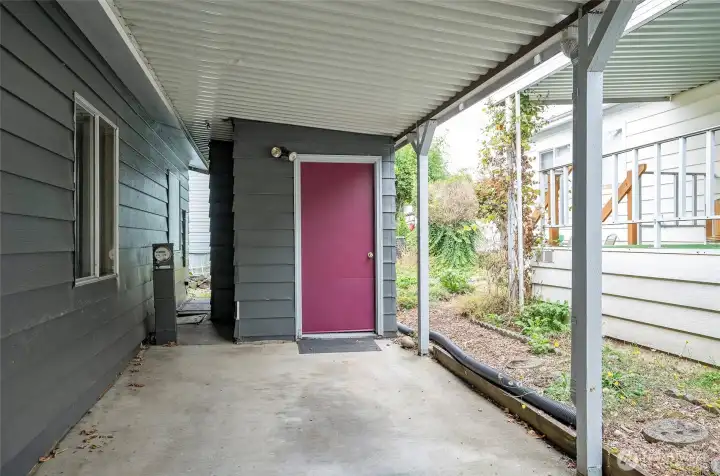 Storage shed with electricity conveniently located at the end of the carport.