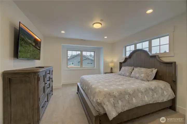 One of the 4 bedrooms upstairs with walk in closet and walk in tiled 3/4 bath