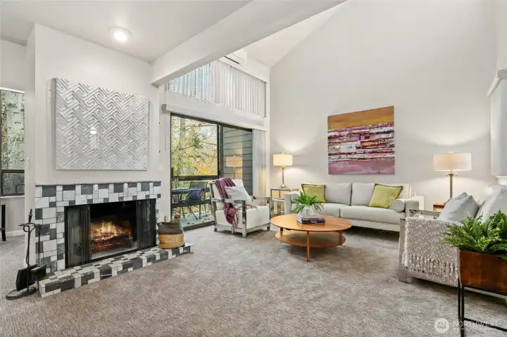 From the dining room looking towards the living room.  Note fireplace and slider to large outside deck