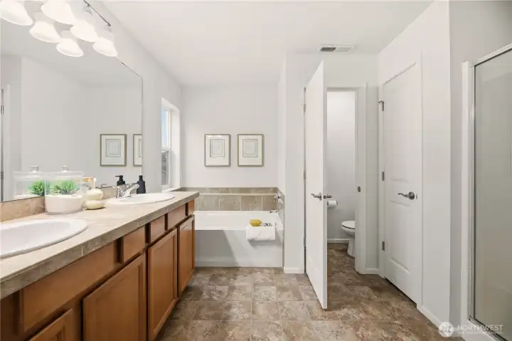 Primary bath with linen closet and soaking tub