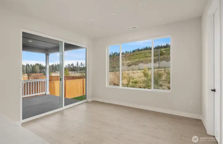 Dining to deck-Same design of home, but a different, sold one.