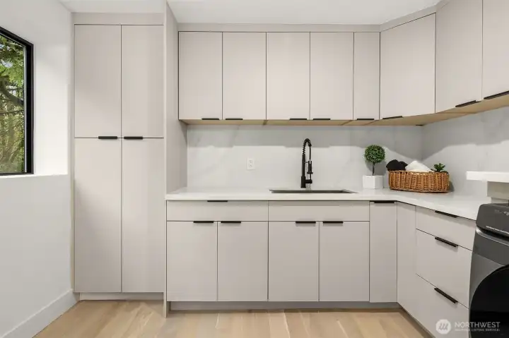 Large laundry with built-in cabinets