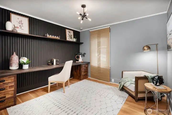 Main level Bedroom with built-in shelving makes a great office too!