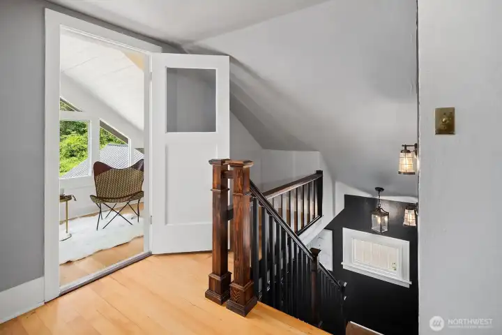 Top of stairs with view to upper sun room.