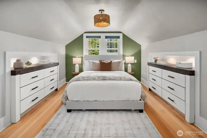 Primary upper level bedroom with beautiful lights.