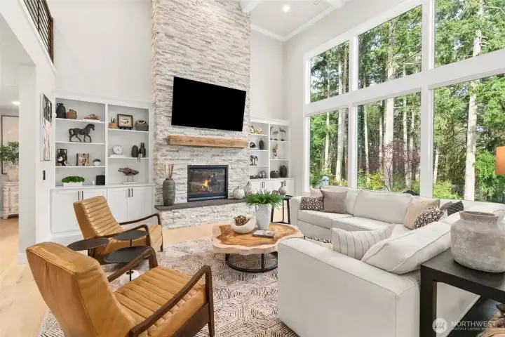 A two-story Eldorado Stone fireplace centers the room.