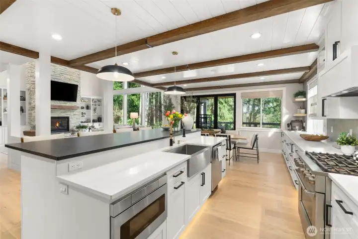 Reclaimed wood beams throughout the kitchen and dining spaces.