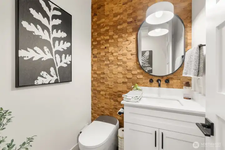 Wood mosaic wall in the downstairs half bath.