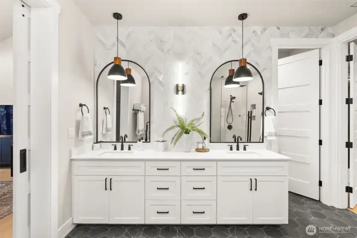 A marble mosaic wall for added elegance in the primary bathroom.