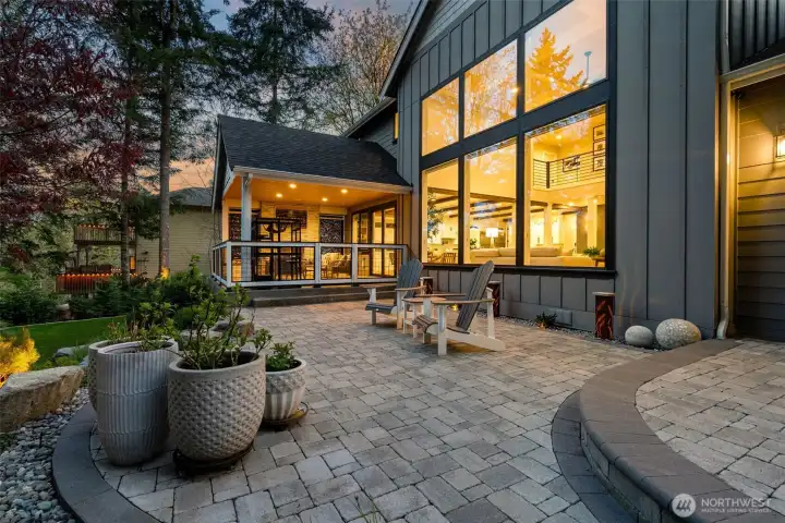 The home at night glows from within.