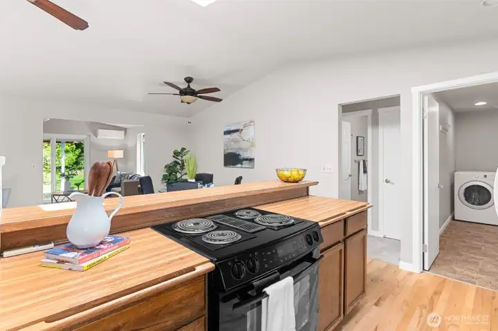 Kitchen overlooks living and dining room